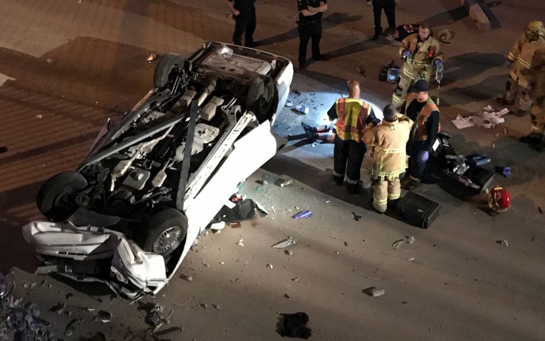Person trapped after vehicle flips into Phoenix dry canal