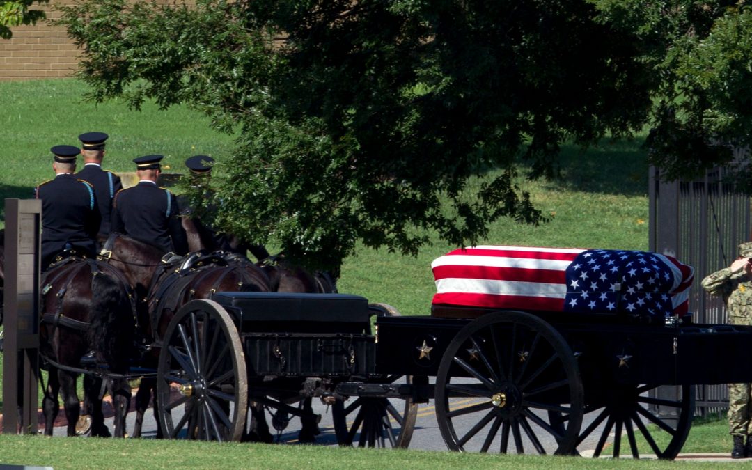 With a flourish, senator laid to rest at Naval Academy