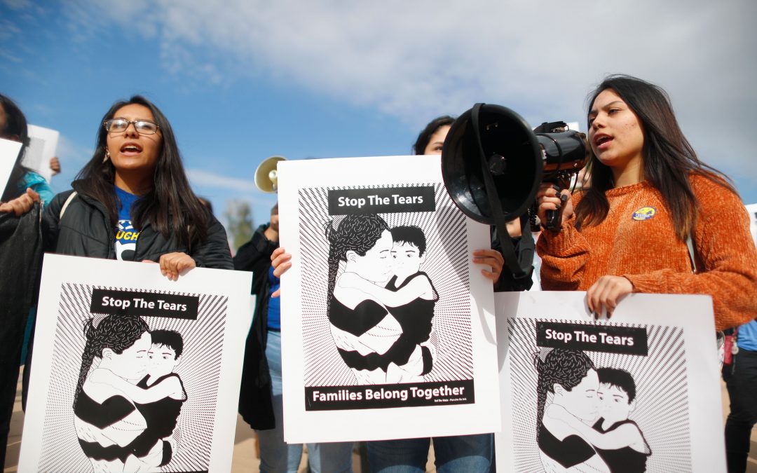 Protesters rally support for migrant caravan at Arizona Capitol